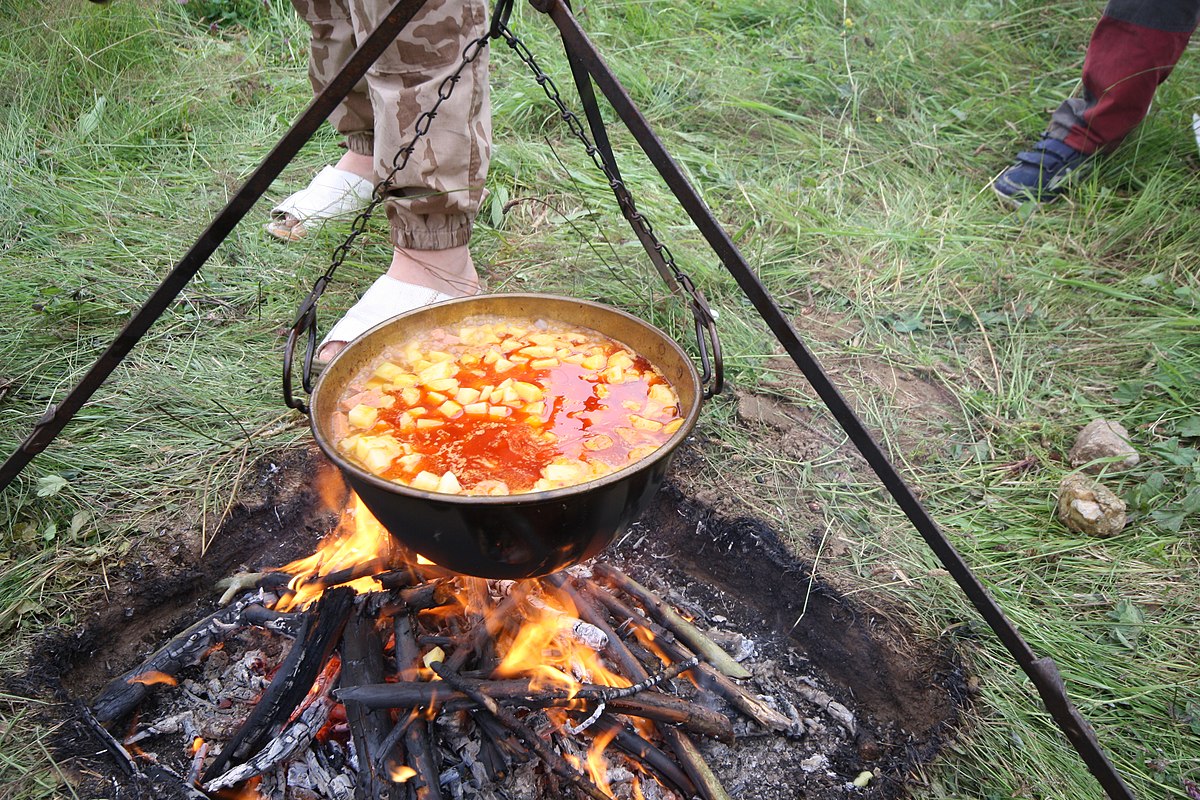 cooking food on a cauldron